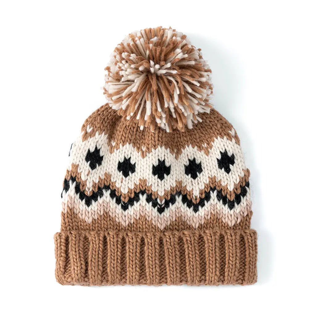 tan black and white winter hat