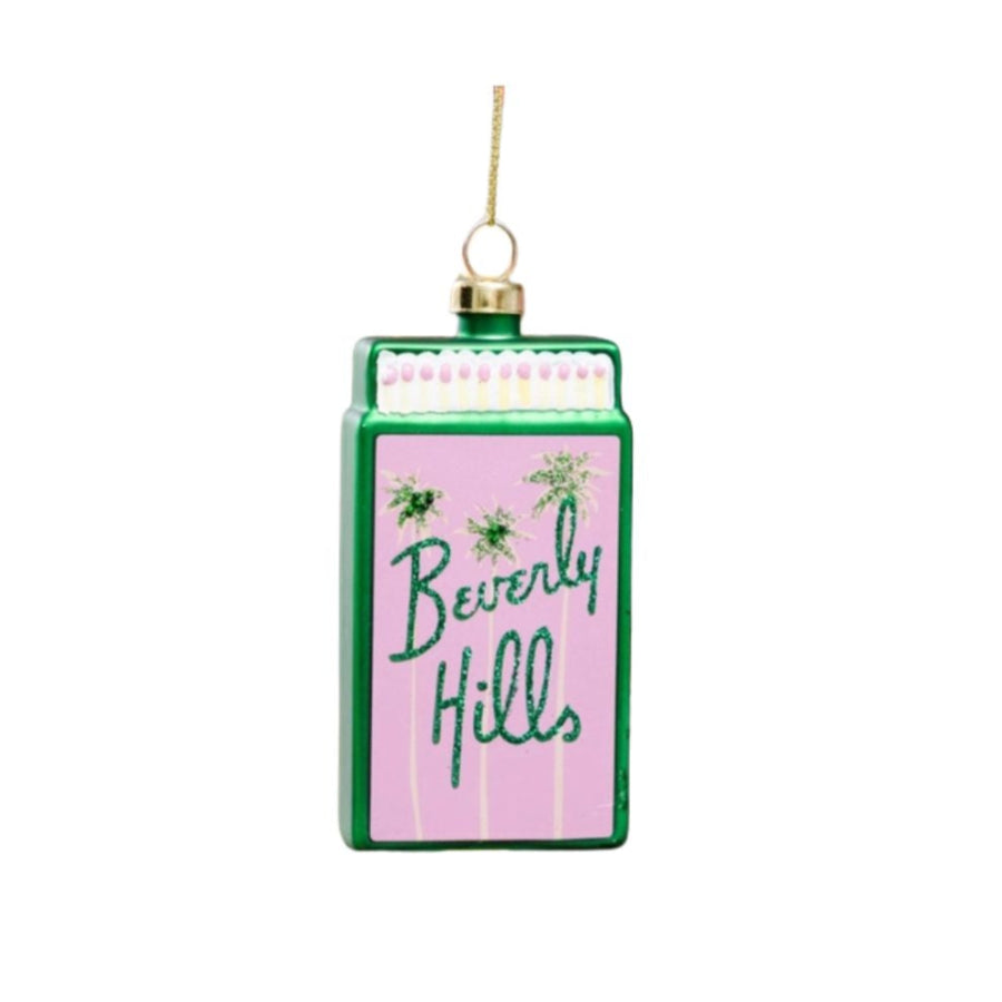 Decorative Christmas ornament resembling a vintage milk carton with 'Beverly Hills' text on a white background
