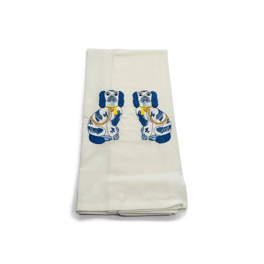 White towel with blue and yellow dog design on a white background