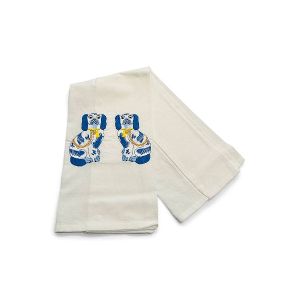 Beige towel with blue and white graphic design on a white background