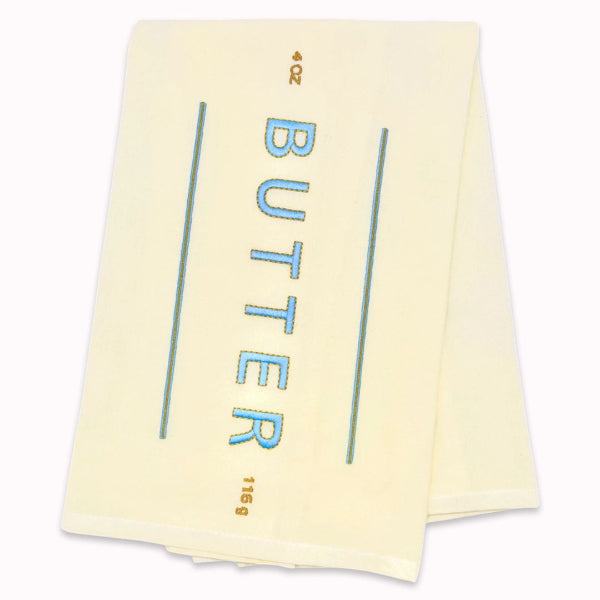 Yellow towel with 'BUTTER' text on a white background