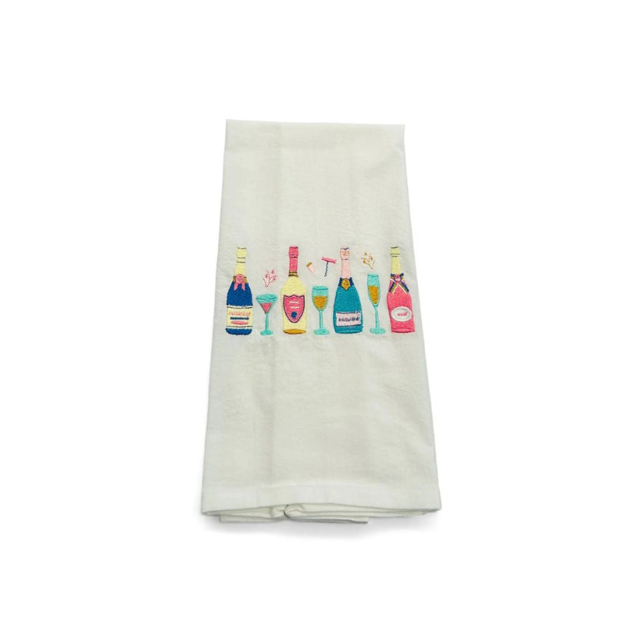 row of Champagne bottles on a white towel 