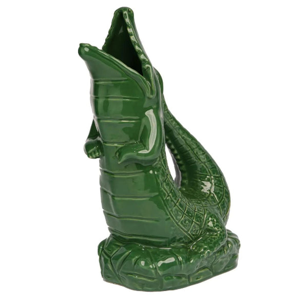 Green ceramic tiki mug with textured design on a white background