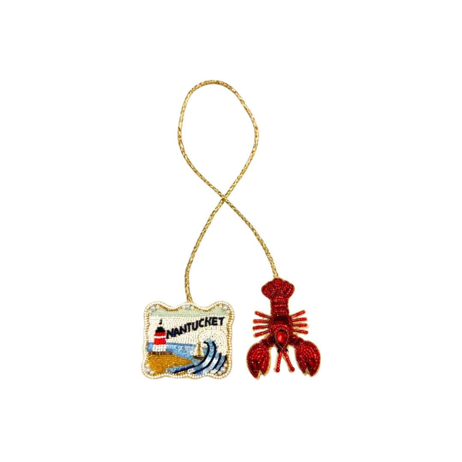 Bag charm with a lobster and Nantucket lighthouse design 