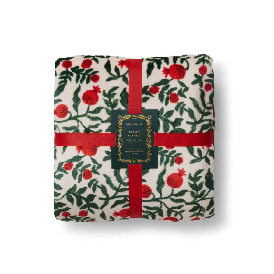 Fleece  blanket with pomegranate and leaf pattern on a white background