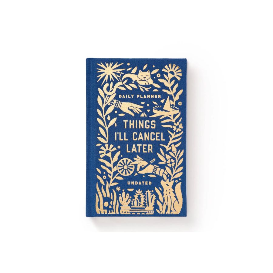 A blue hardcover daily planner with cream-colored illustrated details and the title 'THINGS I'LL CANCEL LATER', photographed on a clean white background.