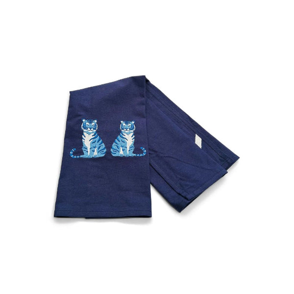 Navy blue towel with blue tiger design on a white background
