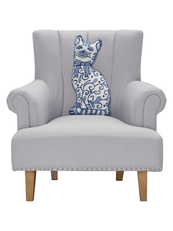Gray armchair with a decorative blue and white cat pillow on a white background