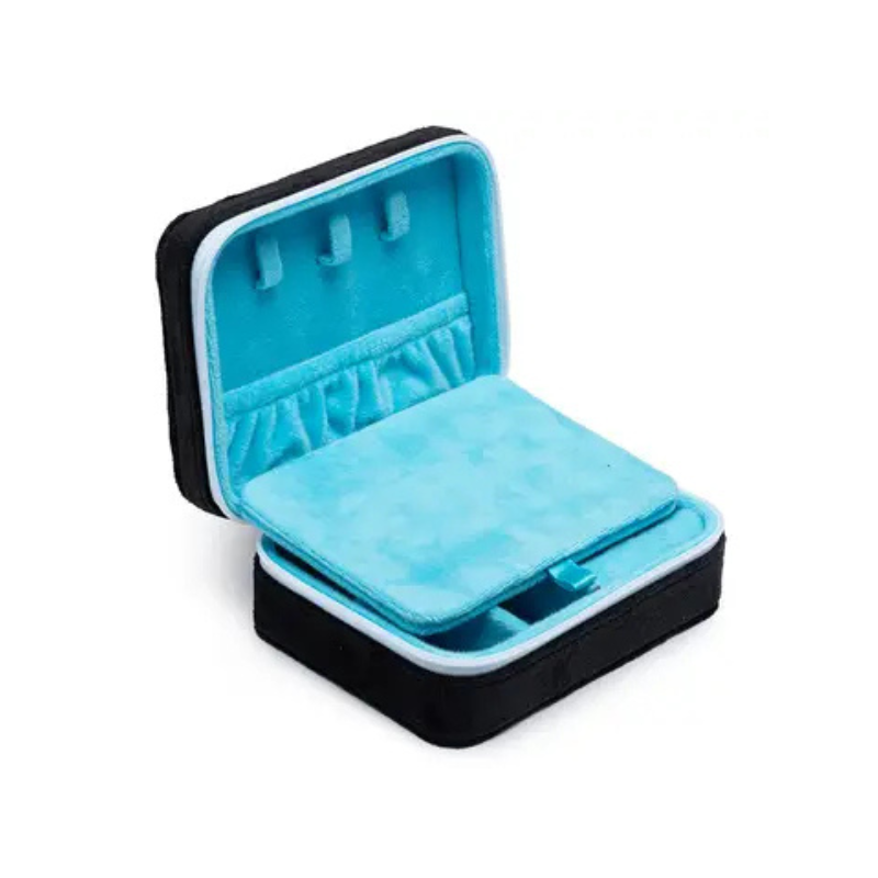 Open jewelry box with blue interior and black exterior on a white background