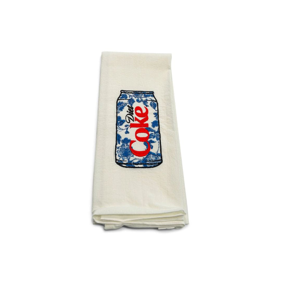 Folded towel with a Coca-Cola can design on a white background