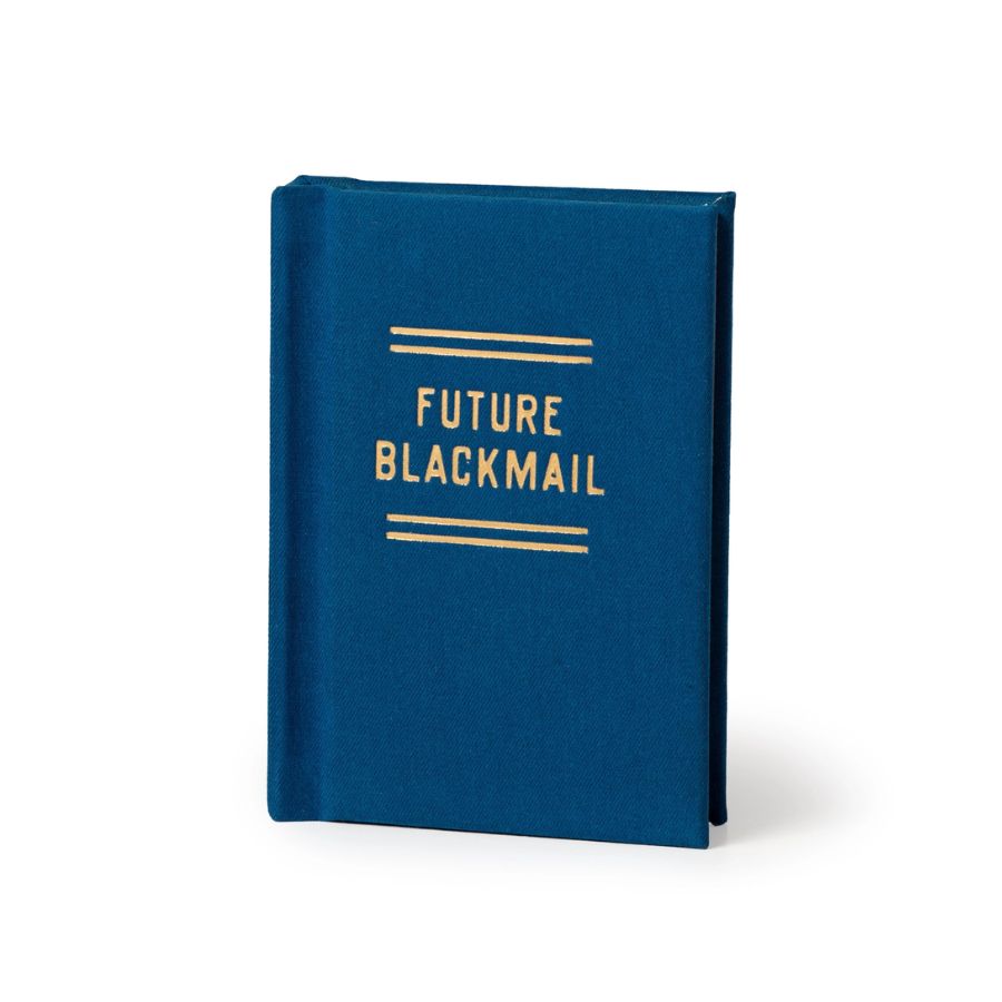 A hardcover notebook or journal with a textured dark blue cover and gold foil lettering that reads 'FUTURE BLACKMAIL' between two horizontal gold lines, shown on a clean white background.