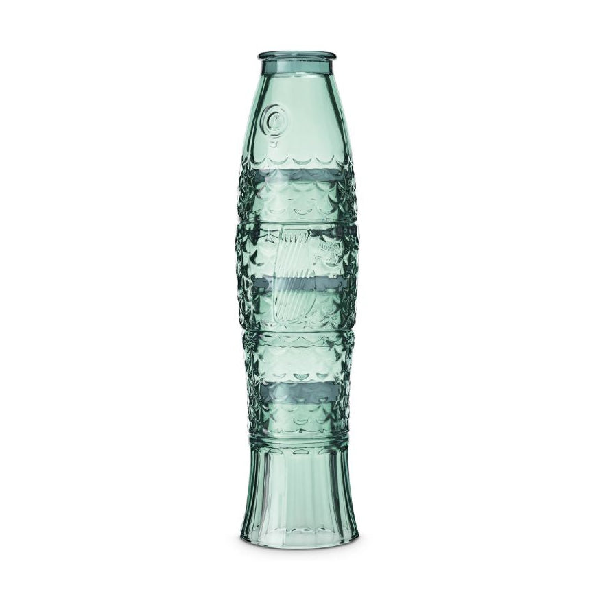 A tall, slender translucent glass vase with a textured, ribbed pattern and a flared base, in a muted sage green color, set against a plain white background.