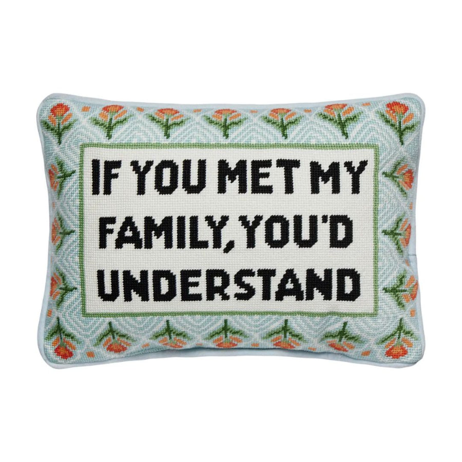 Decorative pillow with text 'If you met my family, you'd understand' on a white background