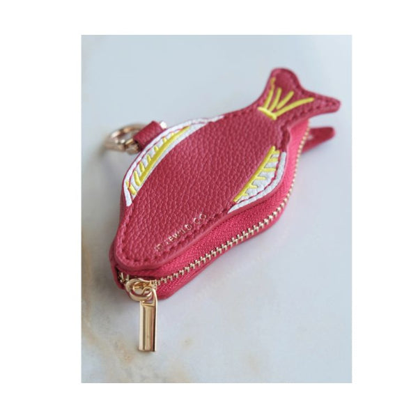 A small fish-shaped zipper pouch in pink pebbled leather with gold-tone hardware, featuring yellow and white embroidered details on the side.
