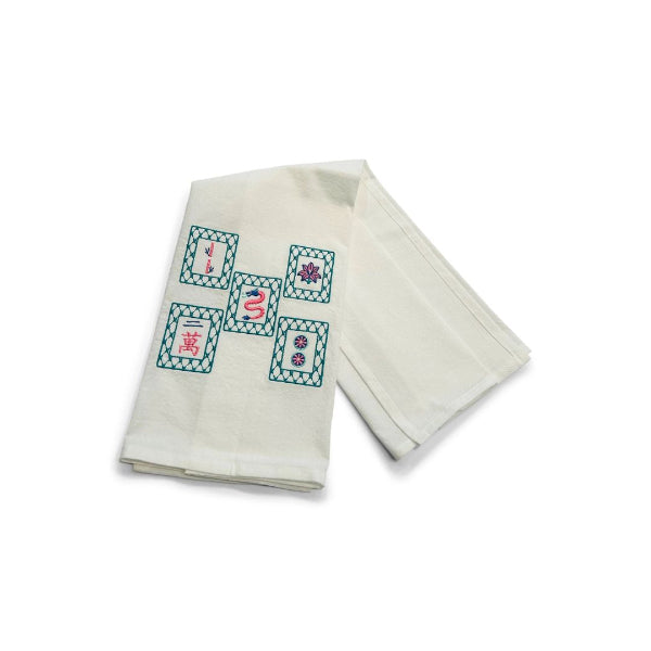 Two folded towels with embroidered  mahjong designs on a white background