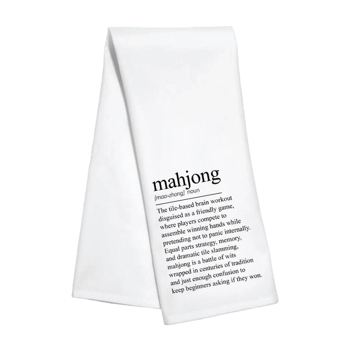 White towel with black text definition of mahjong on a white background