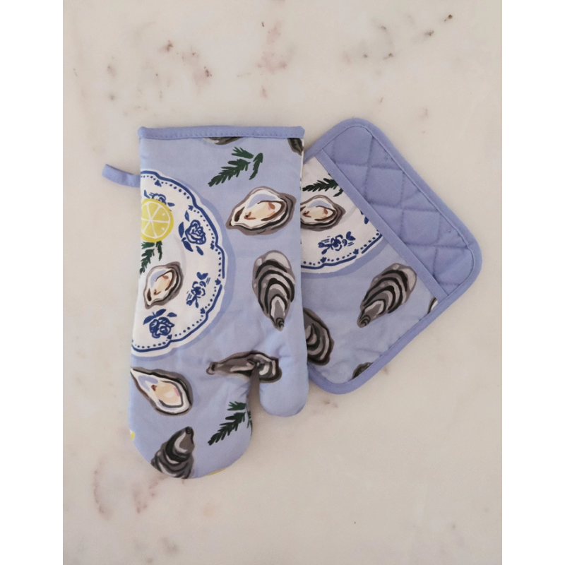 Oven mitt and pot holder with oyster design on a marble surface
