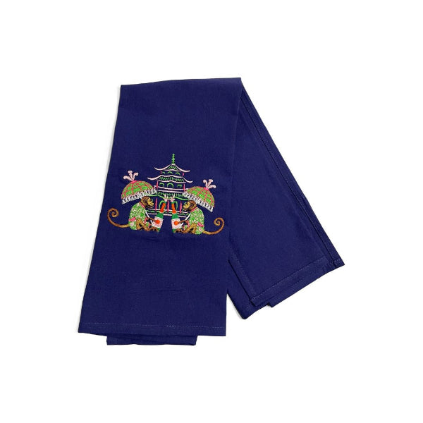 Navy blue towel with colorful monkey and pagoda design on a white background