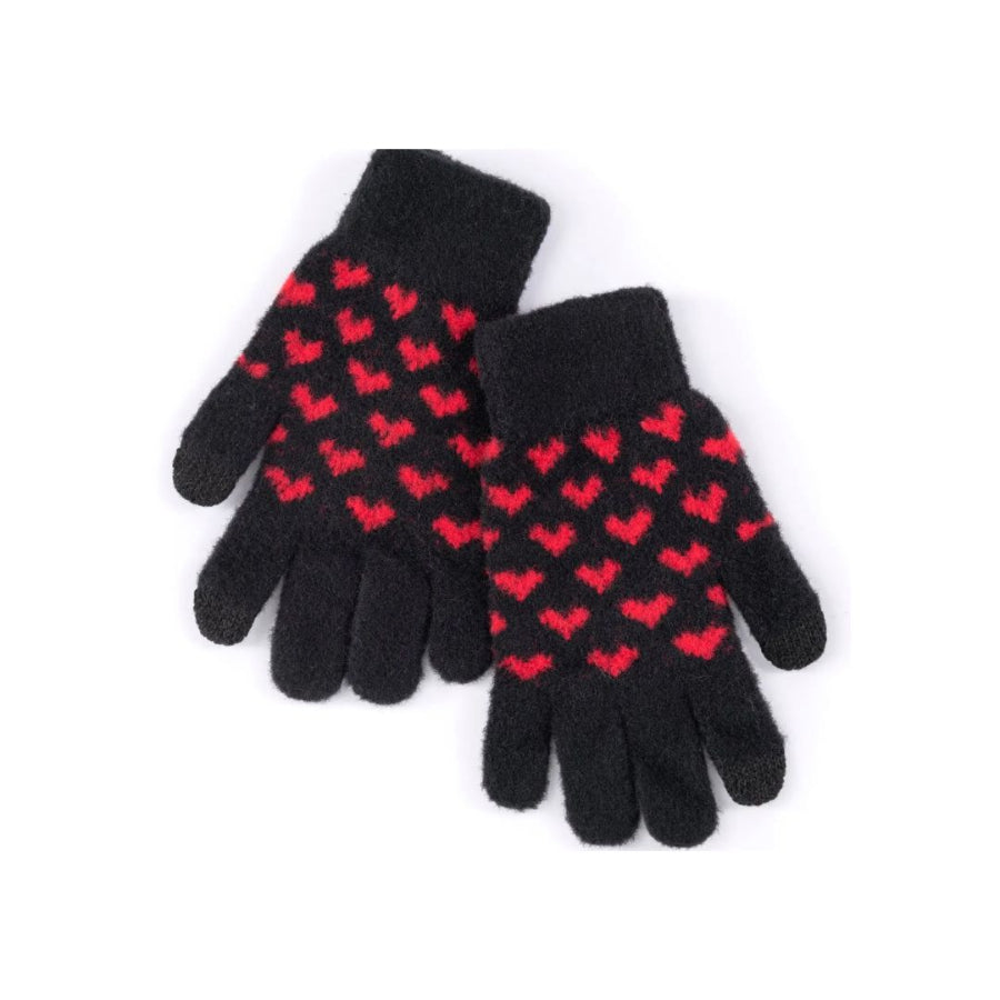Pair of black gloves with red heart patterns on a white background