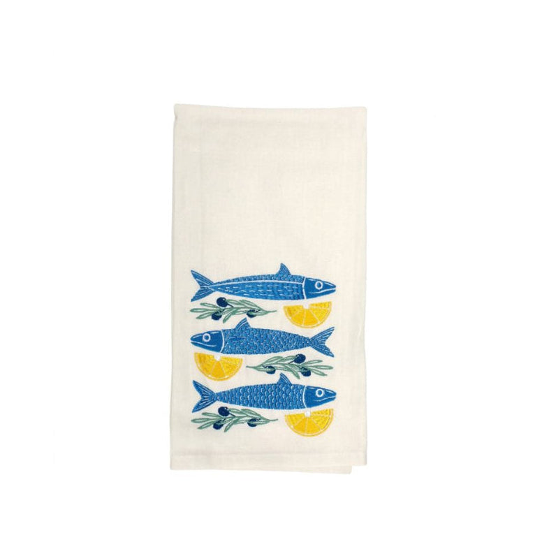 An off-white cotton tea towel featuring a printed pattern of three blue fish with yellow accents, shown against a plain white background.
