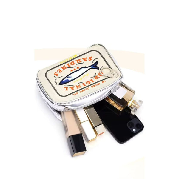 sardine tin cosmetic bag with a vintage-style label on a white background