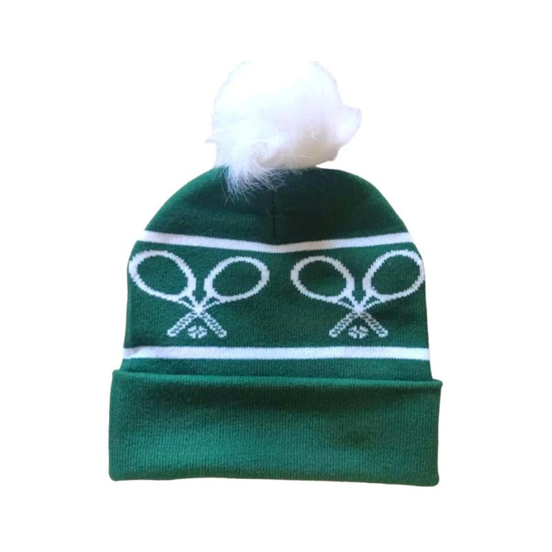 green winter hat with tennis rackets
