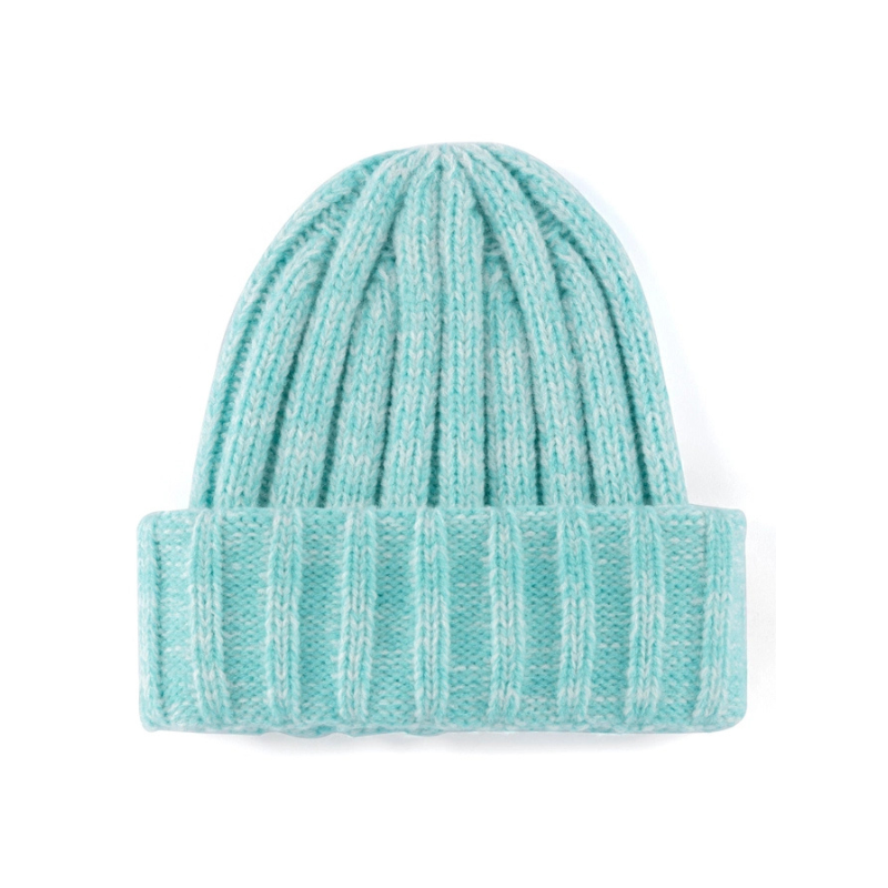 Teal knit beanie on a white background