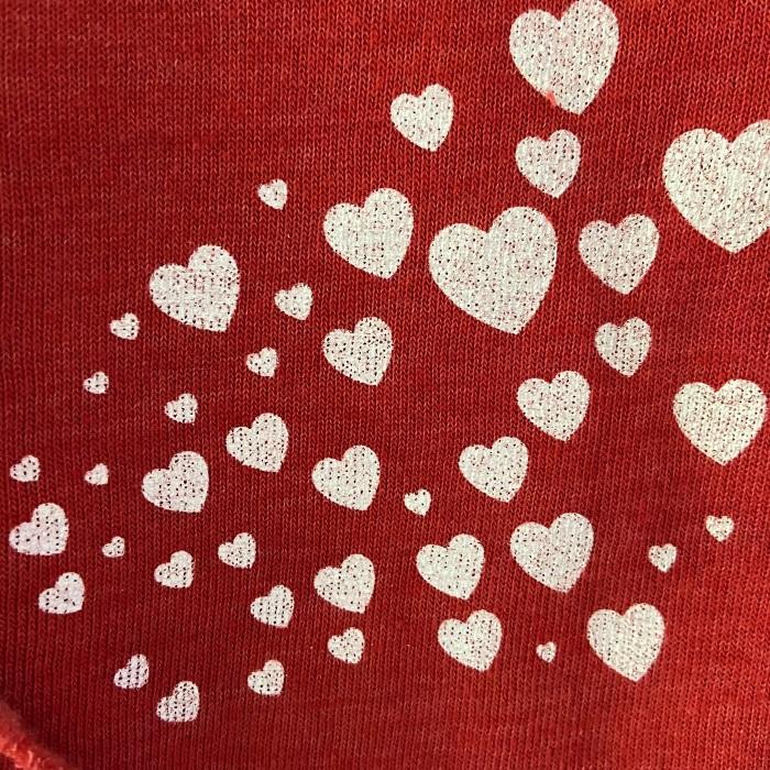 hearts close up on red graphic sweatshirt