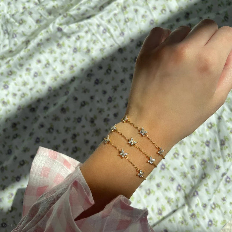 sparkly butterfly bracelets on wrist