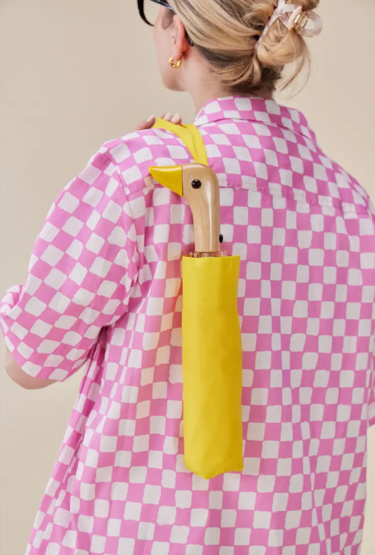 yellow duck umbrella on person